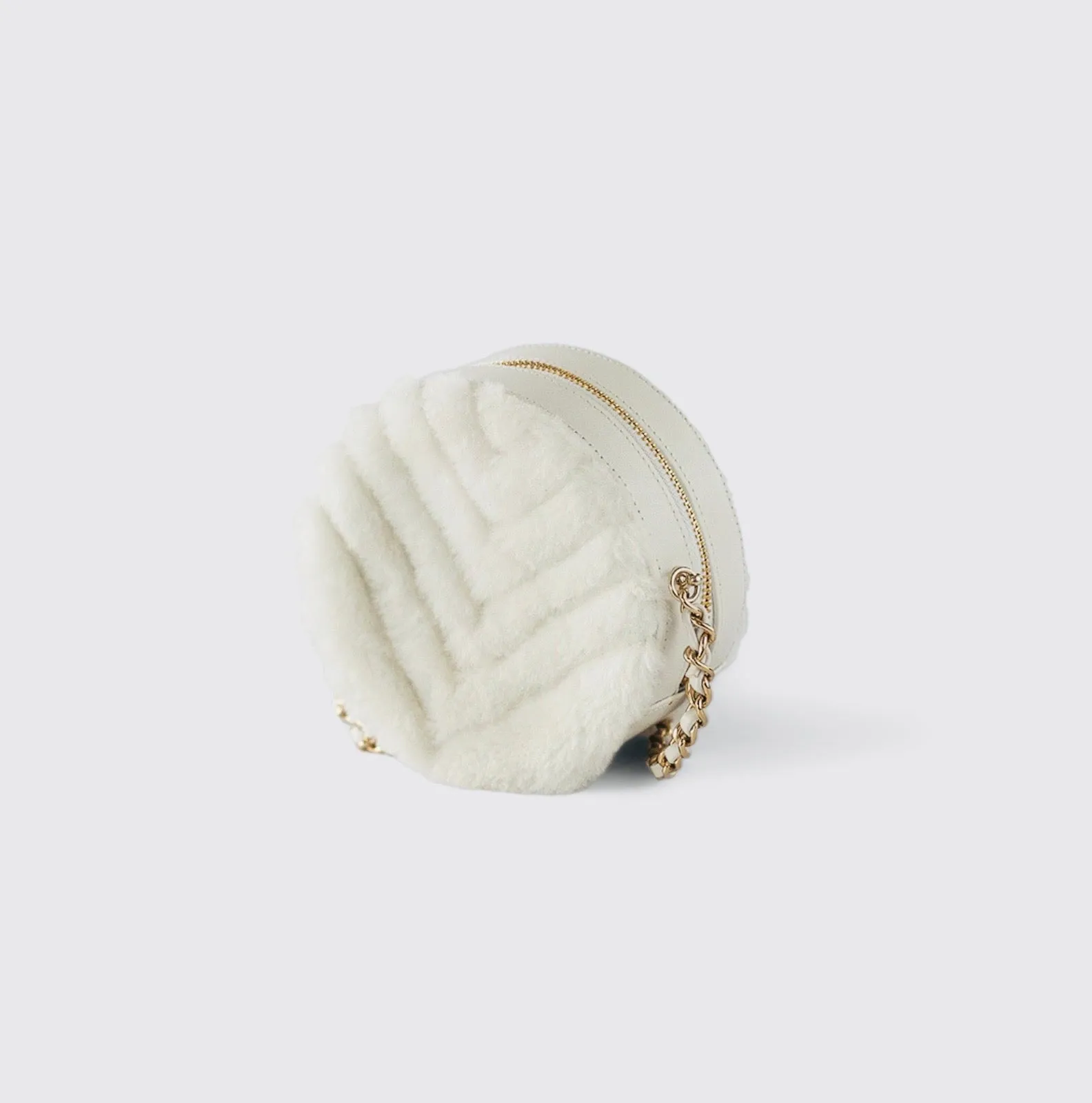 CHANEL - Quilted Round bag white shearling Coco Neige