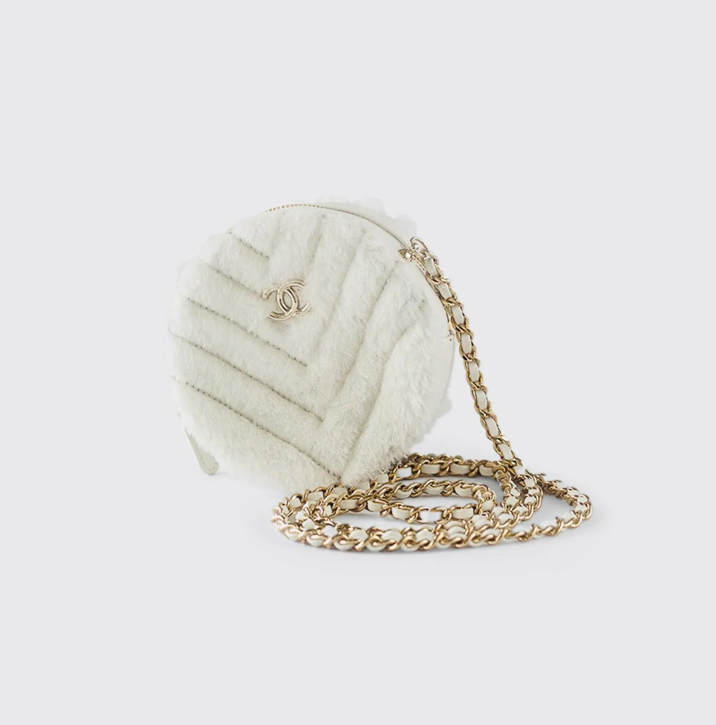 CHANEL - Quilted Round bag white shearling Coco Neige