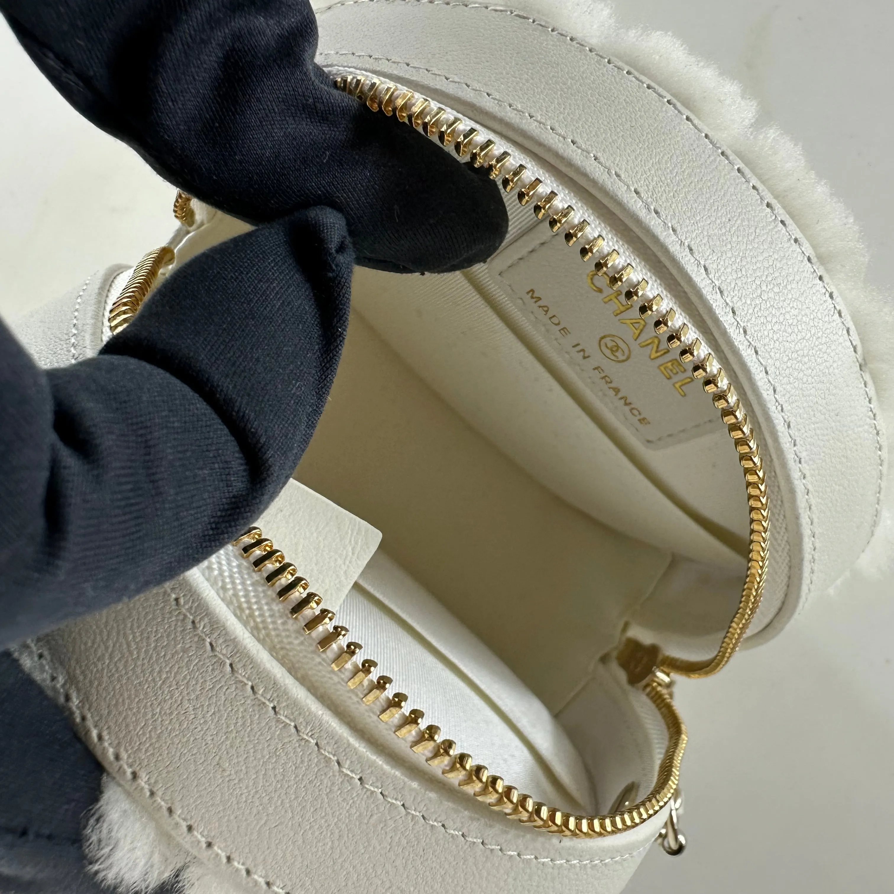 CHANEL - Quilted Round bag white shearling Coco Neige