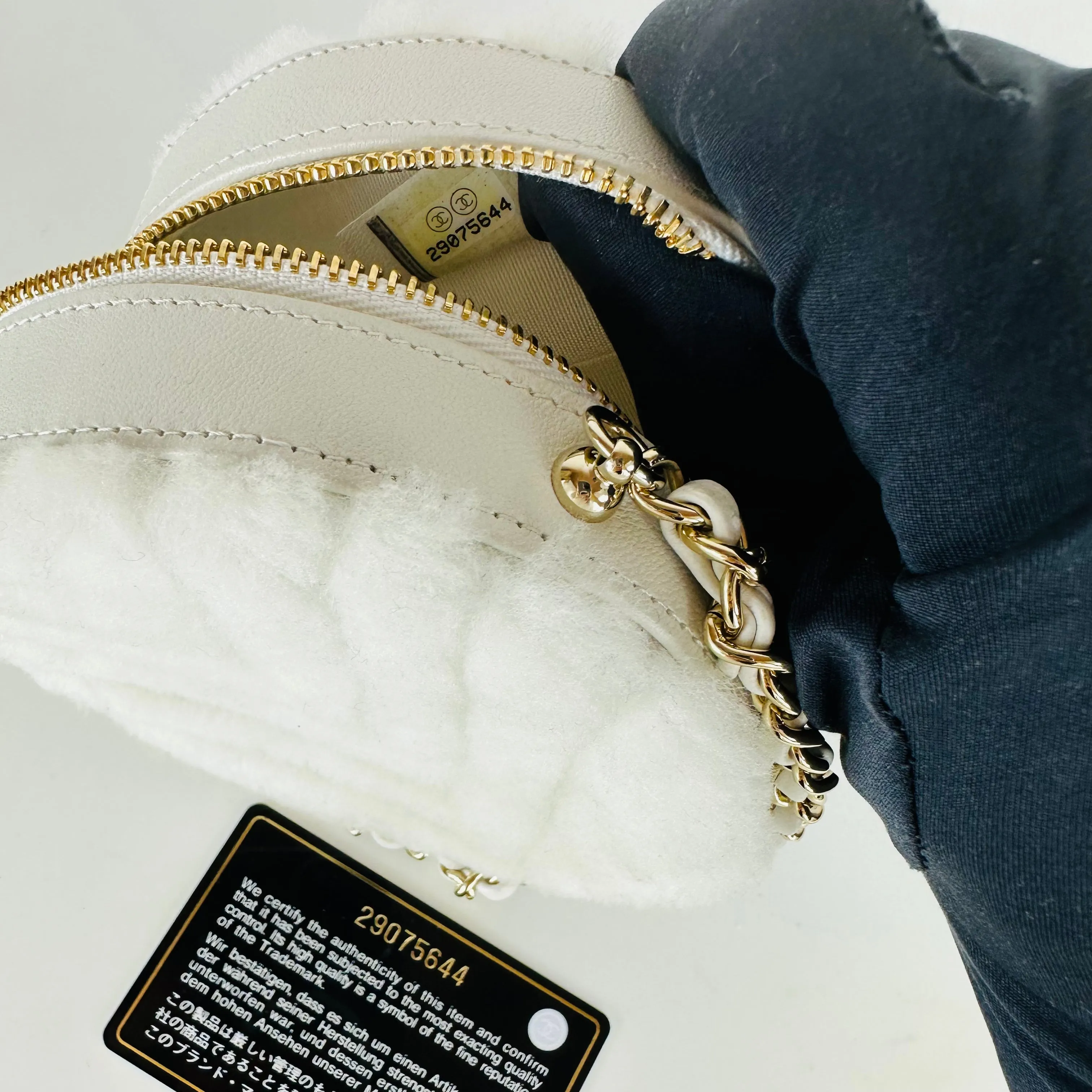 CHANEL - Quilted Round bag white shearling Coco Neige