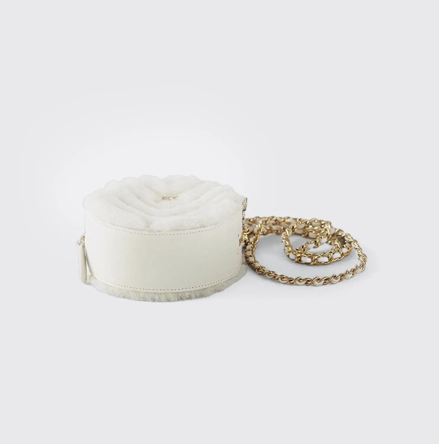 CHANEL - Quilted Round bag white shearling Coco Neige