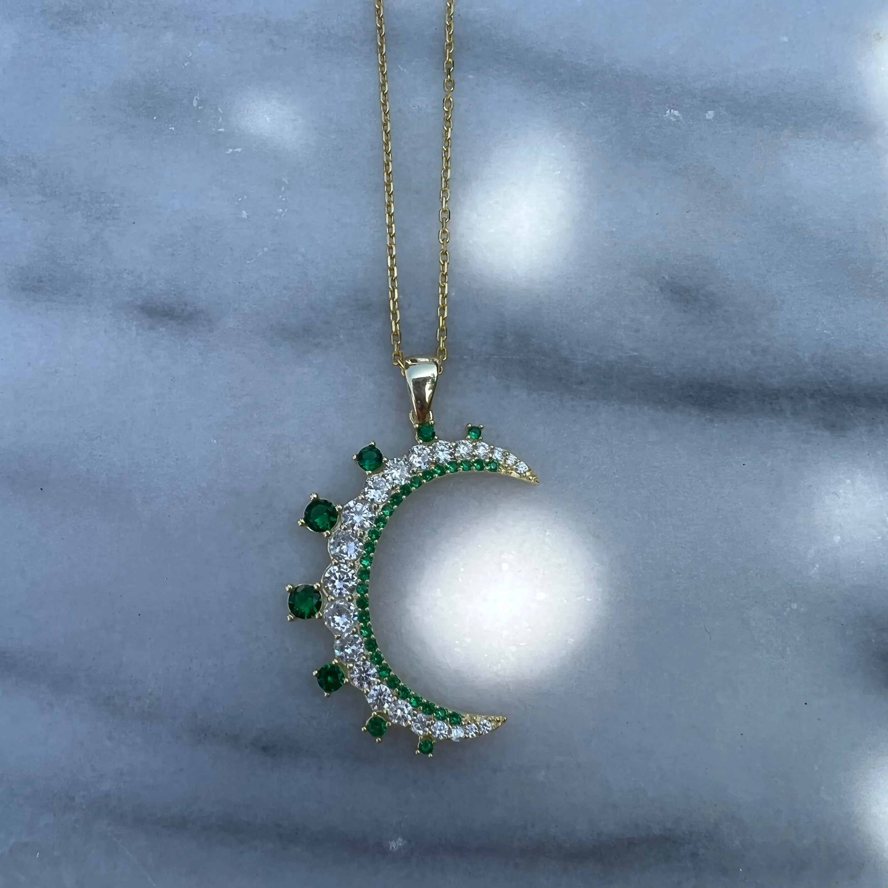 “Mezzaluna” gold green pave crescent necklace